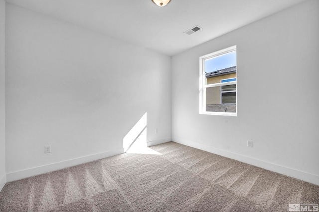 unfurnished room with carpet floors