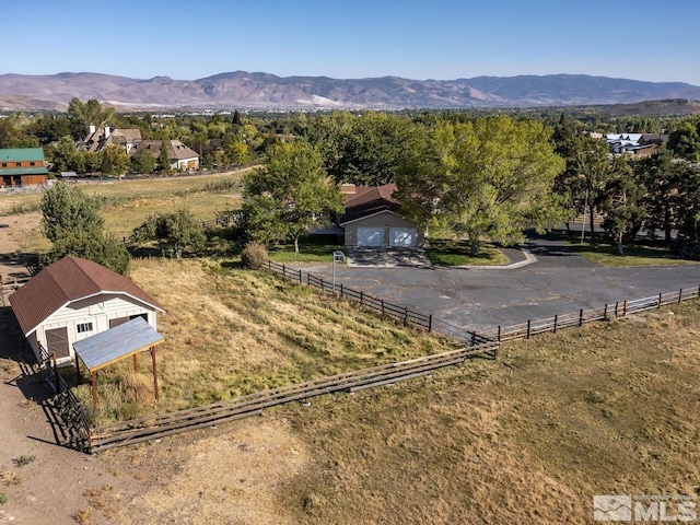 birds eye view of property featuring a mountain view