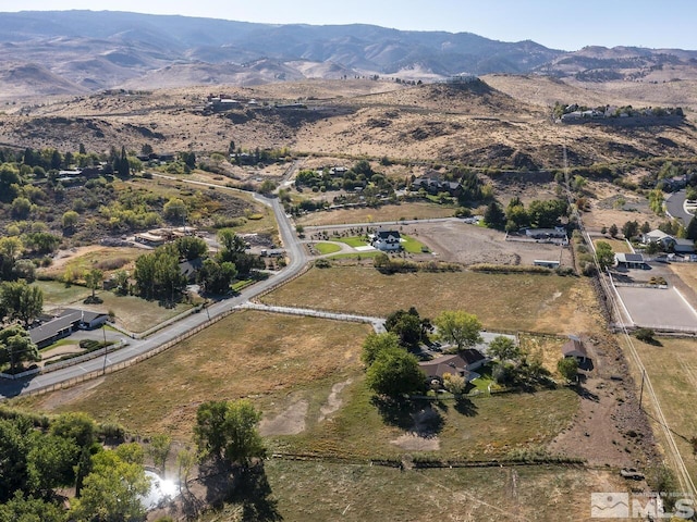 birds eye view of property with a mountain view