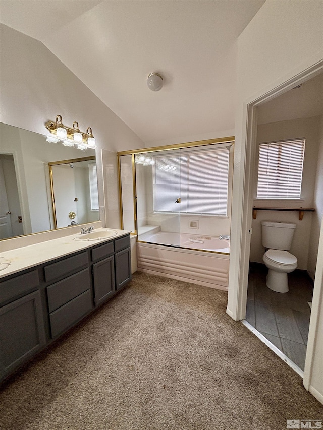 full bathroom featuring vanity, toilet, shower with separate bathtub, and vaulted ceiling