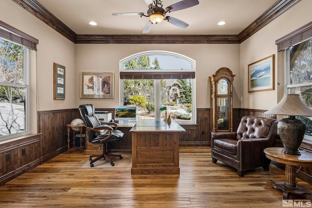 office area featuring hardwood / wood-style flooring, ceiling fan, and ornamental molding