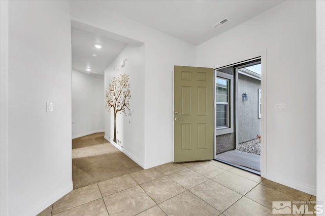 corridor featuring light tile patterned flooring