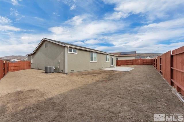 back of house featuring a patio and central air condition unit