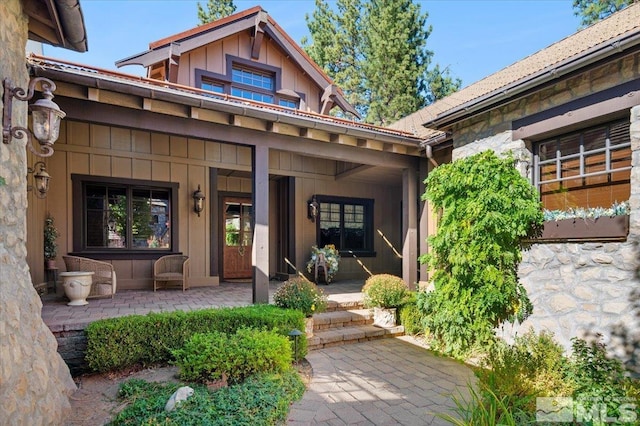 doorway to property featuring a porch