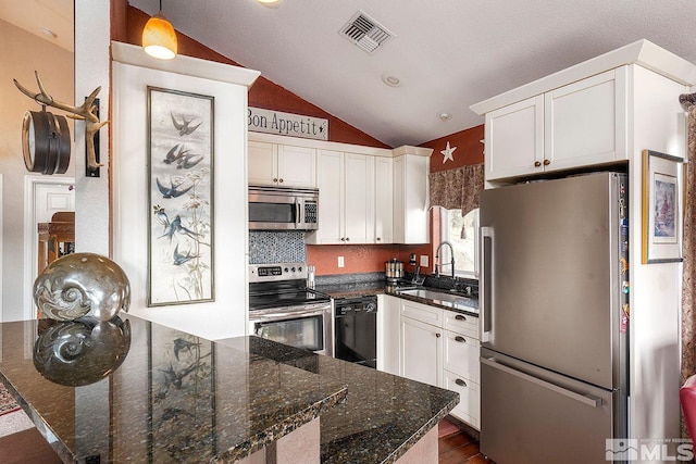 kitchen with stainless steel appliances, white cabinetry, and sink