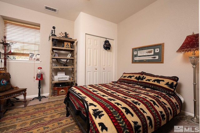 carpeted bedroom featuring a closet