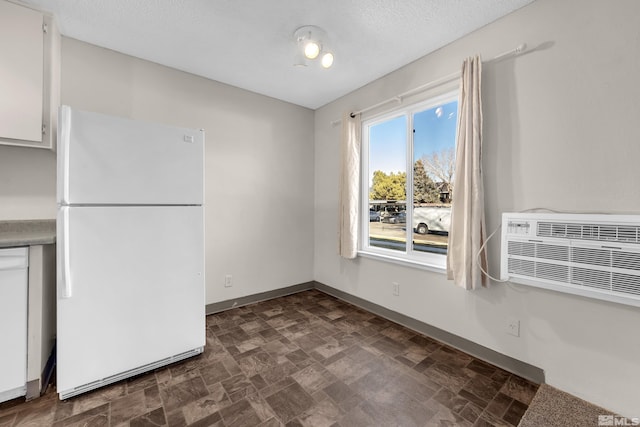 unfurnished dining area with a wall unit AC