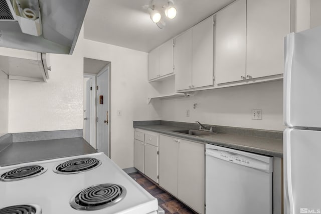 kitchen featuring white cabinets, white appliances, dark wood-type flooring, and sink