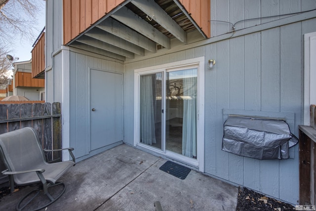 entrance to property with a patio area