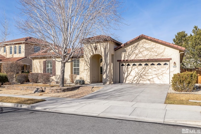 mediterranean / spanish-style home featuring a garage