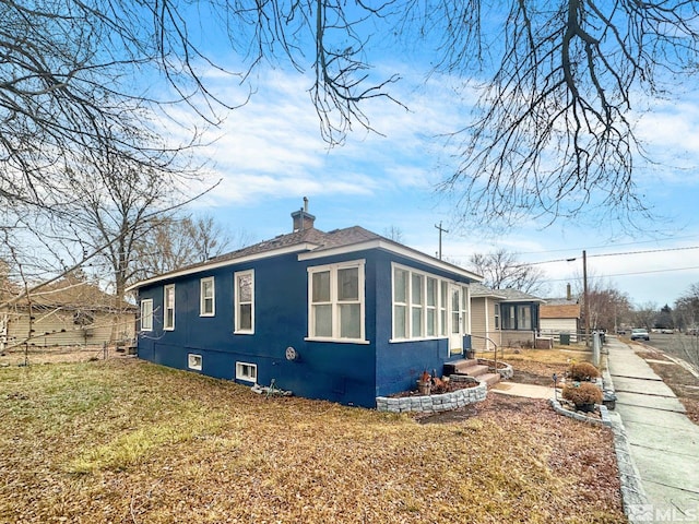 view of home's exterior with a yard