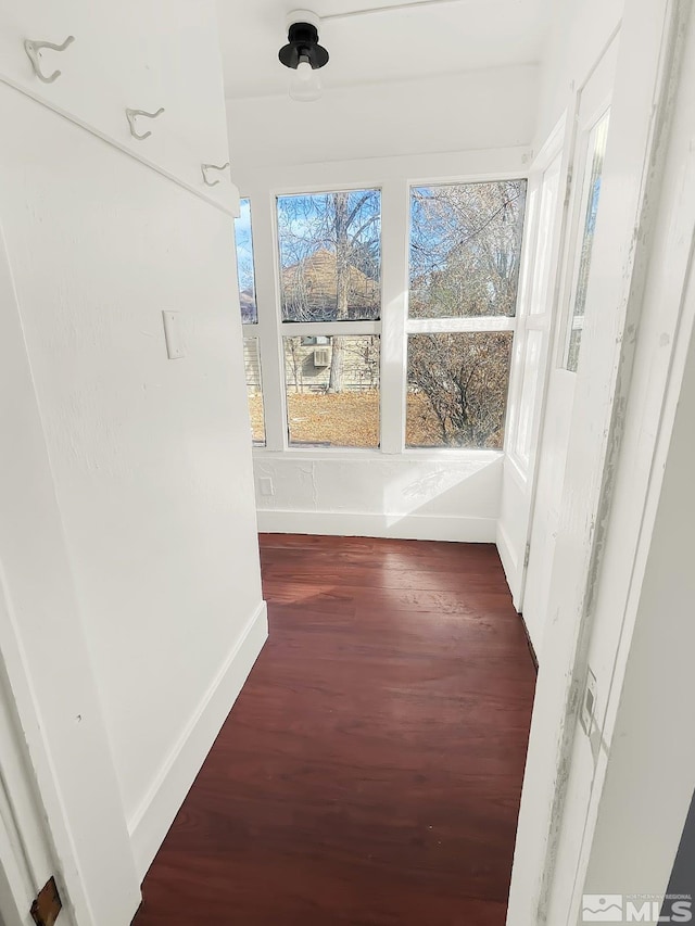 hall with dark hardwood / wood-style floors