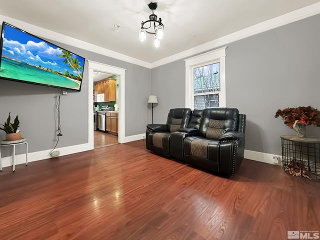 living room with crown molding and wood-type flooring