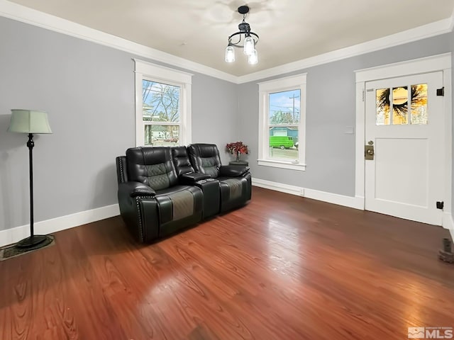 living room featuring wood-type flooring and ornamental molding