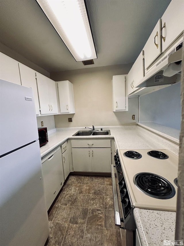 kitchen with sink, white cabinets, and white appliances