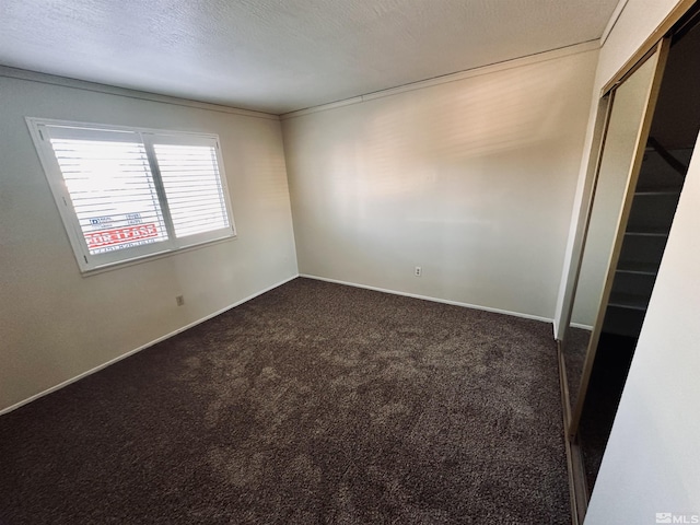 carpeted spare room with ornamental molding