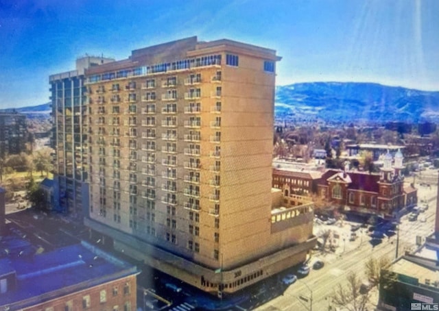 view of building exterior featuring a mountain view