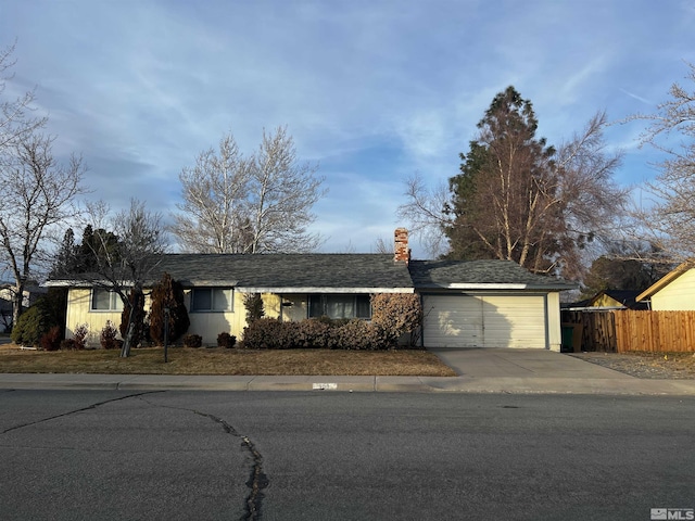 ranch-style home with a garage