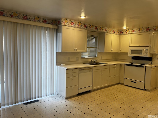 kitchen with white appliances and sink