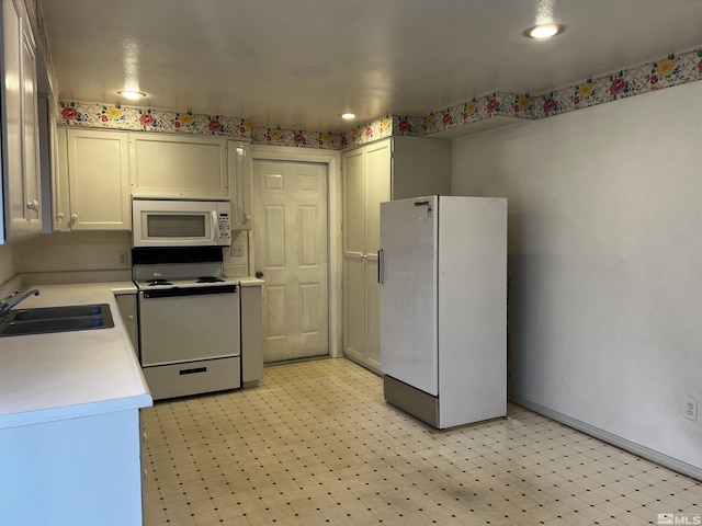 kitchen with white appliances and sink