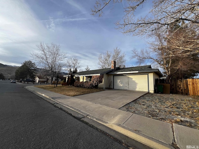 single story home with a garage