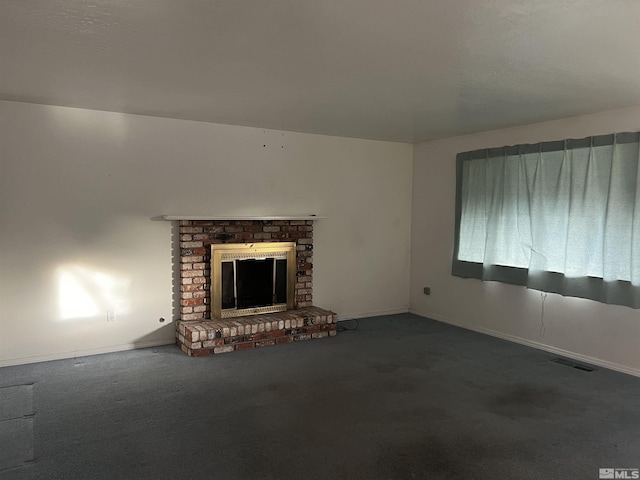 unfurnished living room with a fireplace and carpet floors