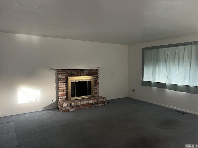 unfurnished living room featuring a fireplace and carpet flooring