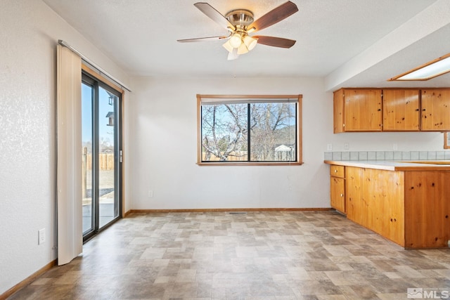 kitchen featuring plenty of natural light and ceiling fan