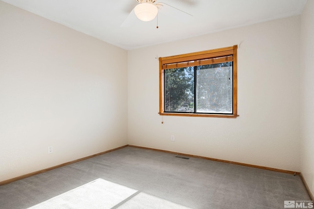 unfurnished room featuring carpet flooring and ceiling fan