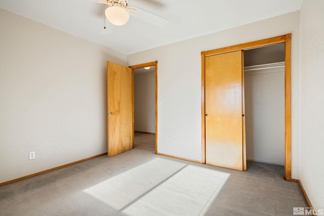 unfurnished bedroom featuring carpet flooring, ceiling fan, and a closet