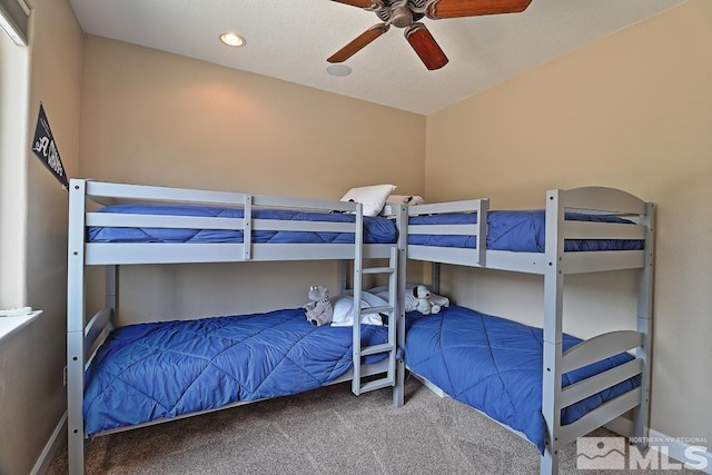 carpeted bedroom featuring ceiling fan