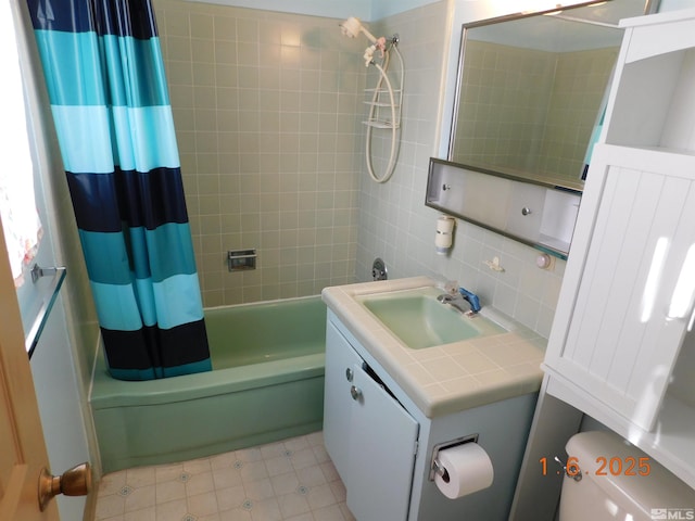 full bathroom featuring shower / bath combo, backsplash, toilet, vanity, and tile walls