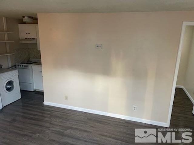 laundry area with washer / clothes dryer and dark wood-type flooring