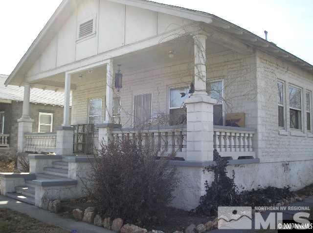 view of property exterior featuring covered porch