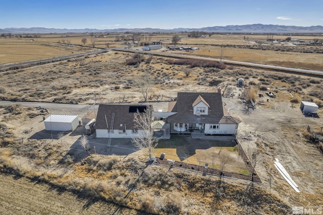 aerial view featuring a mountain view and a rural view