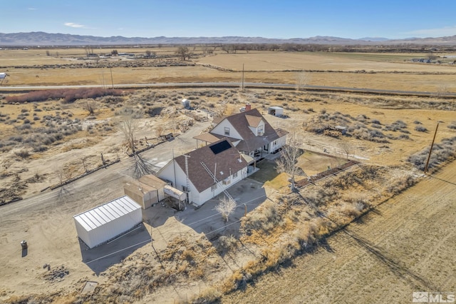 aerial view featuring a mountain view and a rural view