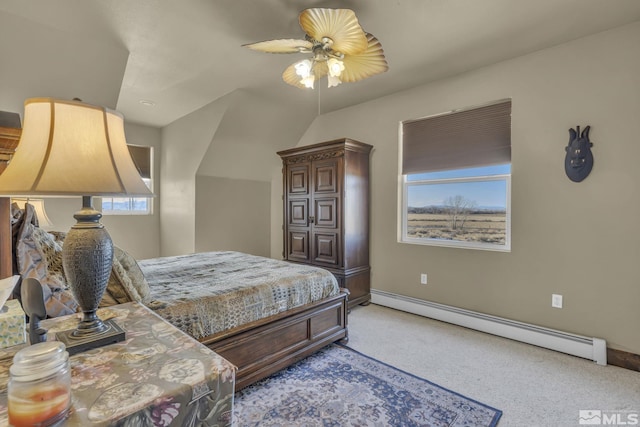 carpeted bedroom featuring ceiling fan and a baseboard radiator