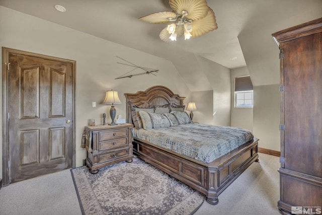 bedroom with ceiling fan and light carpet