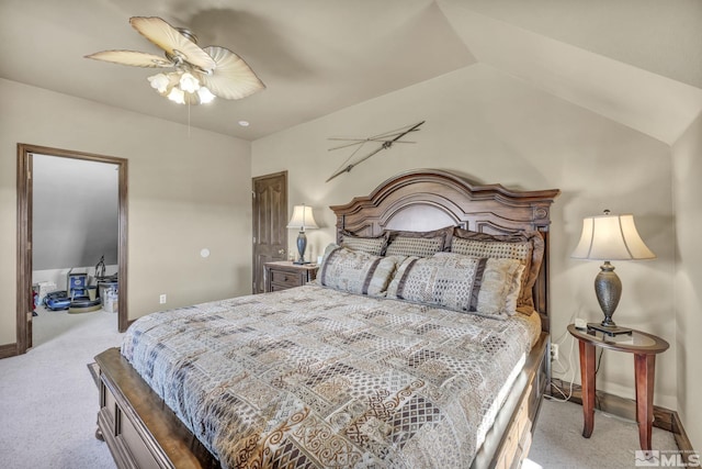 bedroom featuring ceiling fan, light colored carpet, and lofted ceiling