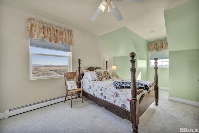 bedroom with carpet flooring, ceiling fan, and a baseboard heating unit