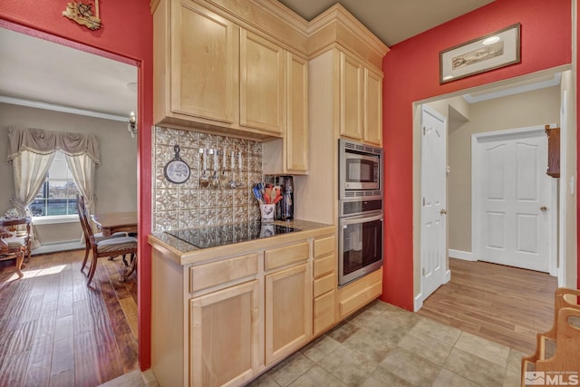 kitchen with decorative backsplash, appliances with stainless steel finishes, light brown cabinetry, crown molding, and light hardwood / wood-style flooring