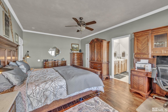 bedroom with light wood-type flooring, ensuite bath, ceiling fan, and crown molding