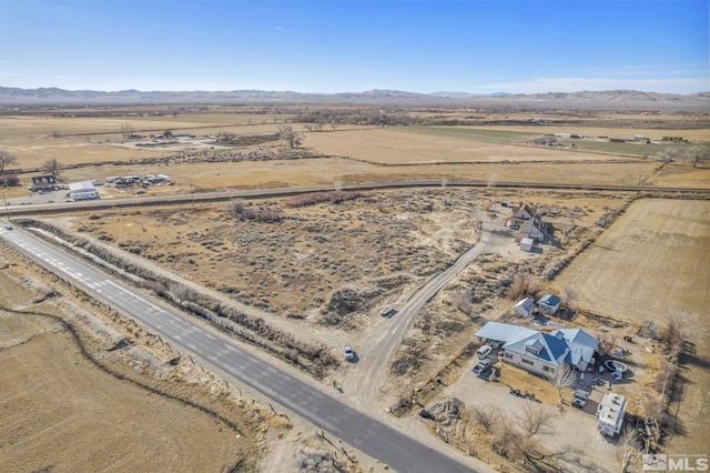 drone / aerial view with a mountain view and a rural view