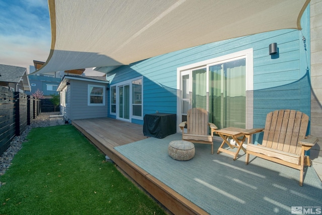 rear view of property featuring a wooden deck