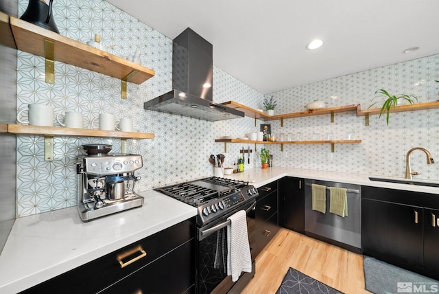 kitchen featuring sink, stainless steel dishwasher, backsplash, black range with gas cooktop, and extractor fan