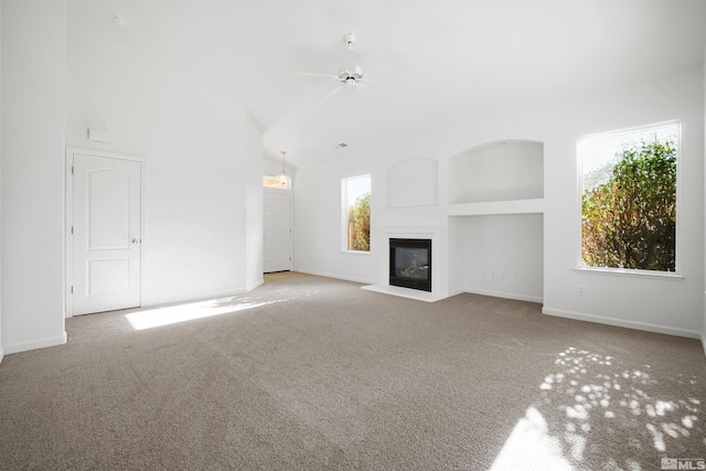 unfurnished living room with ceiling fan and light colored carpet