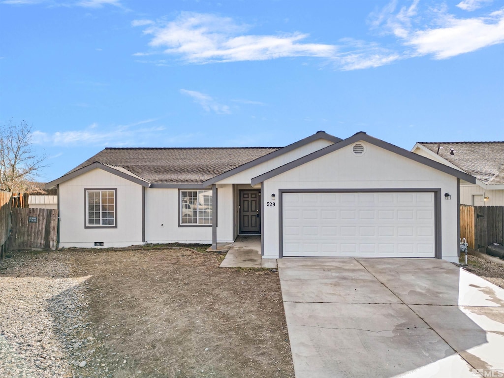 ranch-style home featuring a garage