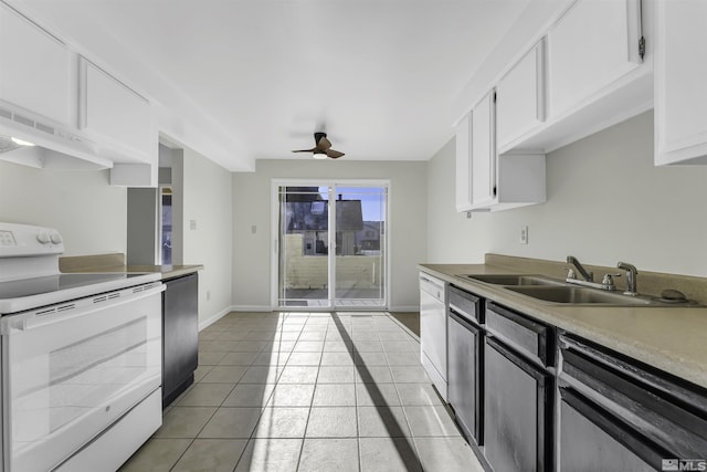 kitchen with white cabinets, light tile patterned floors, white appliances, and sink