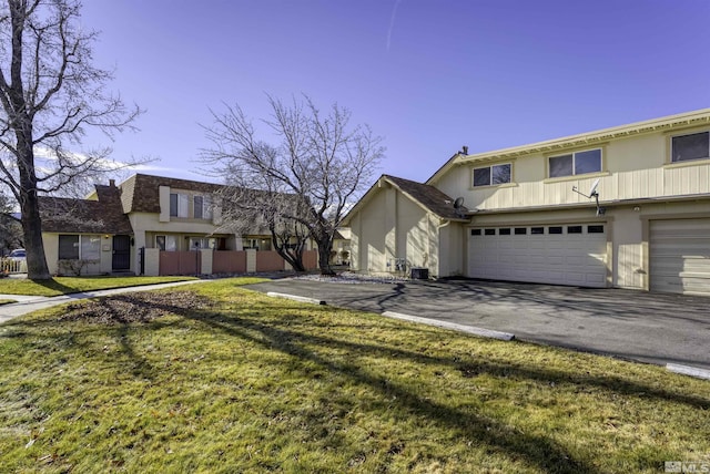 view of front facade with a garage and a front yard