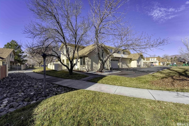 exterior space featuring a garage and a lawn